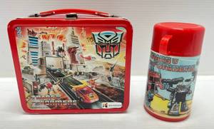 lot 200 image: 1986 Aladdin Hasbro (Transformers) Embossed Metal Lunchbox & Thermos