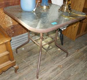 lot 6 image: Two patio tables and 1 umbrella