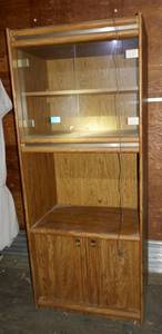 lot 7 image: Cabinet with glass doors on top, wood on bottom, roll top middle