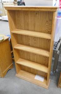 lot 26 image: Adjustable shelf bookcase 25w x 6 deep x 48 tall