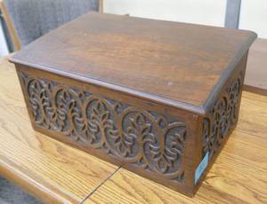 lot 45 image: an interesting slanted top engraved wood chest 17x10x9