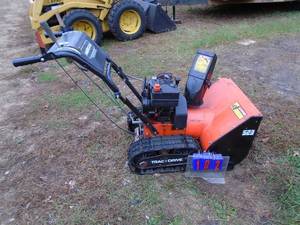 lot 102 image: Americana 523 track drive snow blower. Used condition. Tested & works. As shown.