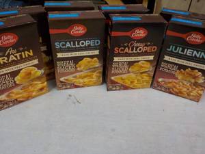 lot 100 image: 8 Boxes Betty Crocker Potatoes Meals - 2 each Julienne, Cheesy Scalloped, Scalloped, and Au Gratin best date 07262023