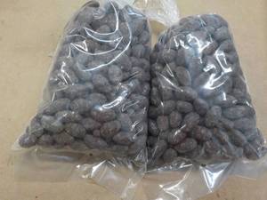 lot 276 image: 2 - 2 lb. bags Chocolate Covered Almonds