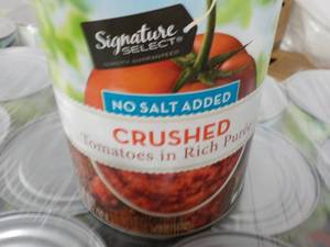 lot 384 image: 12 - 28 oz cans Signature Crushed Tomatoes - no salt added