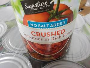 lot 385 image: 12 - 28 oz cans Signature Crushed Tomatoes - no salt added