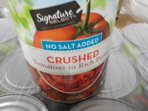 lot 386 image: 12 - 28 oz cans Signature Crushed Tomatoes - no salt added