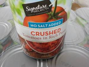 lot 387 image: 12 - 28 oz cans Signature Crushed Tomatoes - no salt added