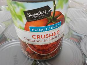 lot 388 image: 12 - 28 oz cans Signature Crushed Tomatoes - no salt added