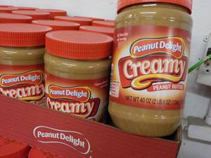 lot 399 image: 6 - 40 oz Jars Peanut Delight Peanut Butter best date 082023