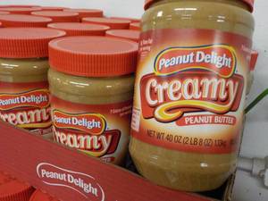 lot 401 image: 6 - 40 oz Jars Peanut Delight Peanut Butter best date 082023