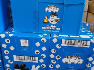 lot 511 image: 3 boxes Stuffed Puffs Milk Chocolate Filled Marshmallows Best By 05212022