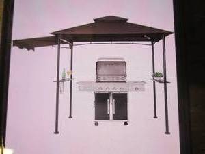 lot 185 image: (PLT4) Fab Based 5x8 Grill Gazebo with Awning in Brown