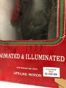 lot 409 image: Large Boy & Girl Animated & Illuminated Christmas Caroler Figures