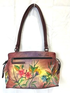 lot 7 image: Anuschka Hand Painted Leather Crossbody Hummingbirds Floral Handbag (14 Long x 10 Tall)