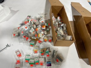 BOX FULL OF SCREW EYES, CORNICE HOOKS, EYE BOLTS, COTTER PINS, WIRE BRADS, AND SCREW HOOKS