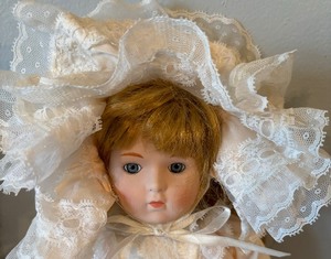 lot 280 image: Two Porcelain Dolls by Dynasty Dolls