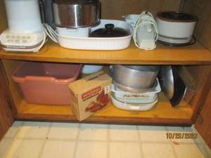 Lower cupboard containing a Kitchen...