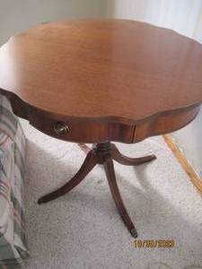 Ornately detailed ruffled round cla...