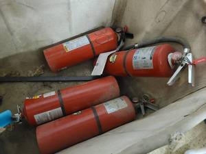 Large used postal service mail cart with fire extinguishers