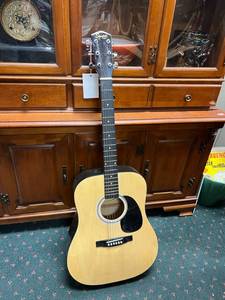 lot 50 image: Squier by Fender Guitar