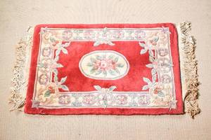 lot 59 image: Small Chinese Inspired Red Fringe Rug