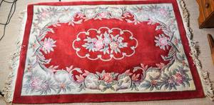 lot 60 image: Large Chinese Inspired Red Fringe Rug