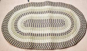 lot 62 image: Oval Earth Toned Woven Rag Rug