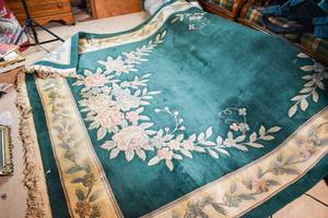lot 67 image: Large Chinese Inspired Green Fringe Rug