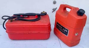 lot 541 image: Two Red Utility Jugs, Jenny Jug, Outboard