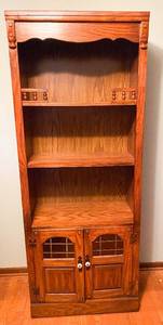 lot 8 image: Large Solid Wood 2 Tier Bookshelf with Storage Compartment and Stained Amber Glass Windows