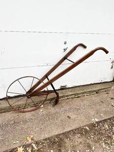 lot 500 image: Antique Steel Wheeled Garden Push Plow