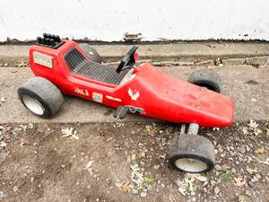 lot 11 image: Vintage Red Plastic Chain Drive Pedal Car, Possibly Sears