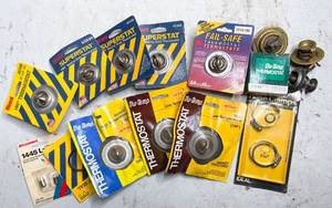lot 747 image: Box of Car Thermostats, SealsGaskets, Bulbs, and Hose Clamps