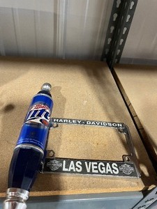 lot 23 image: Miller lite tap handle  Harley License plate holder
