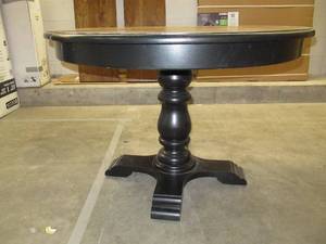 lot 1 image: Vintage Farmhouse Single Pedestal Table Oak Finish on Black Trim 44 Dia. 33 H w 2 44 x 16 Leaf Inserts