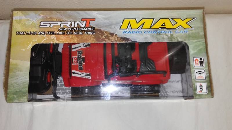 lot 640 image: Battery Operated Cross-Country Car with Steering Wheel Remote Control