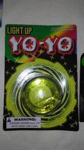 lot 540 image: Light Up Yo-yo, Flying Gliders (2) and LED Finger Lights