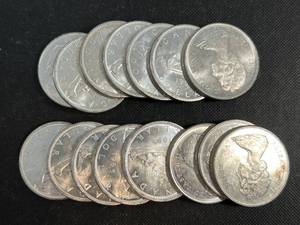 GROUP OF 15 UNCIRCULATED CANADIAN SILVER DOLLARS