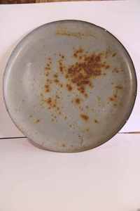 lot 1 image: Coca-Cola pop bottle button sign. Painted tin, some scratches and rust, marked A-M 4-53, 24 diameter