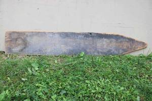 lot 10 image: Vulkan Best Chilled Plow sign. Painted wood, single sided, was cut into an arrow and has a large crack on the right hand side