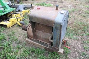 lot 24 image: Leroi stationary engine, 4 cylinder with a twin disc clutch, running condition unknown, but turns freely