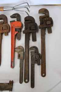 lot 56 image: Eight Pipe Wrenches, Vintage Garden Cultivator (Mi8ssing Handle) Vintage Adjustable Wrench, and More