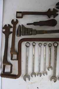 lot 63 image: Buggy Wrenches, Combination Wrenches, and an Old Car or Tractor Crank