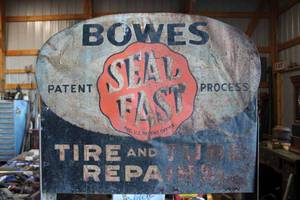 lot 69 image: Bowes Tire Repair bench with sign, the sign has creases and some paint loss, neat tire graphics