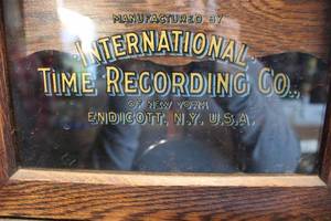 lot 72 image: Antique International Time Recording punch clock, working condition unknown, pendulum and key included, 13x10x32