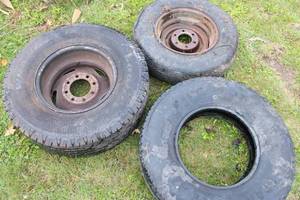 lot 104 image: Lot of 3 spare tires, Goodyear 16 in. on a 8 bolt Dodge rim LT265-75R18, Firestone LT235-85R16, Spare 6 bolt rim 215-75R15