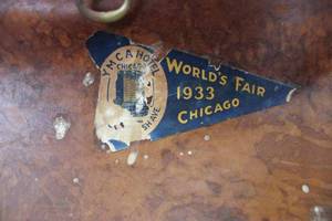 lot 112 image: Antique leather travel bag with 1933 Chicago Worlds Fair pennant decal & MN pennant decal, some seams letting loose