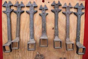lot 127 image: Board of 11 antique buggy wrenches