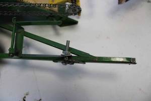 lot 158 image: Lot of antique toys, Tru-scale John Deere pull type combine with a broken hitch, tin milk wagon thats missing its top